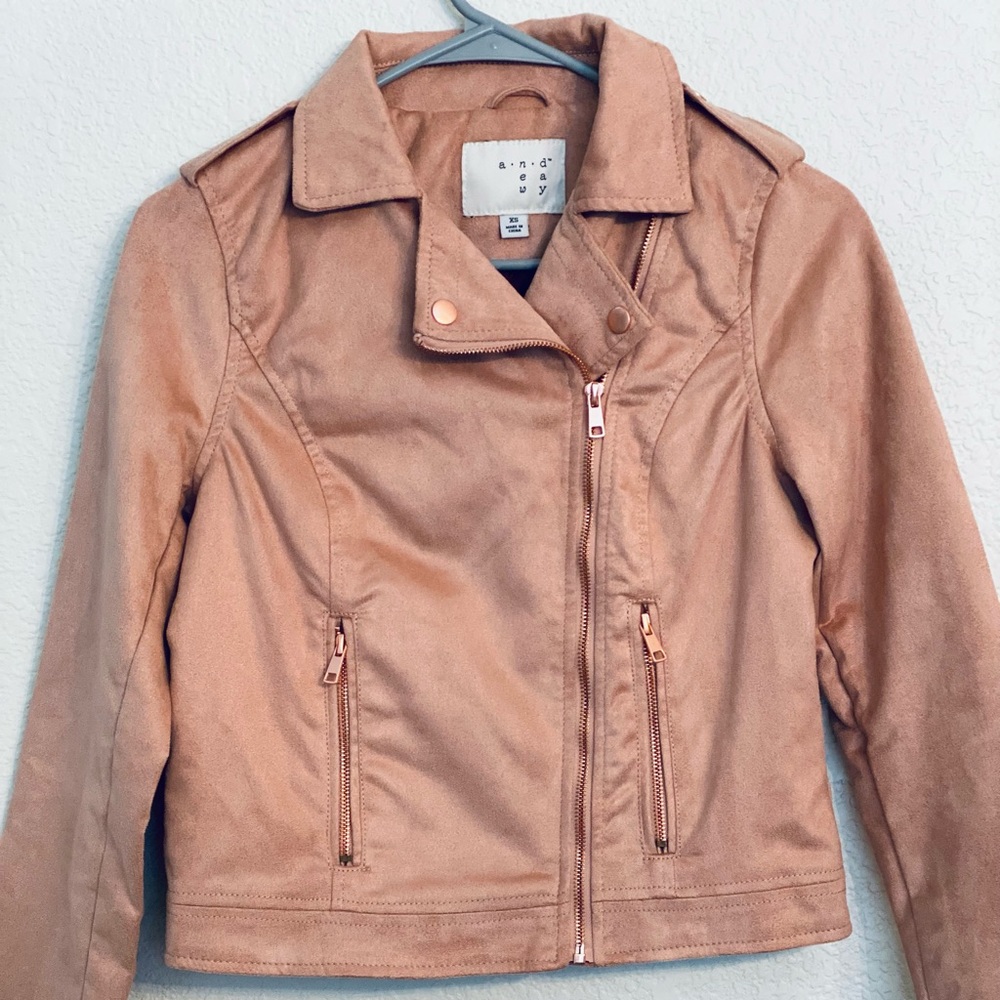 Suede like fabric and feel-pink with rose gold color accents. XS worn twice